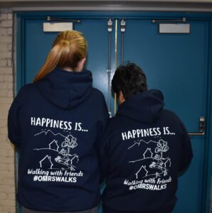 Staff members wearing happiness is OMRS shirts